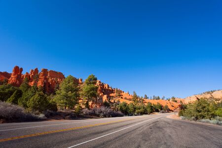 Road through Red Canyon Utah with columns on the backgroundの写真素材