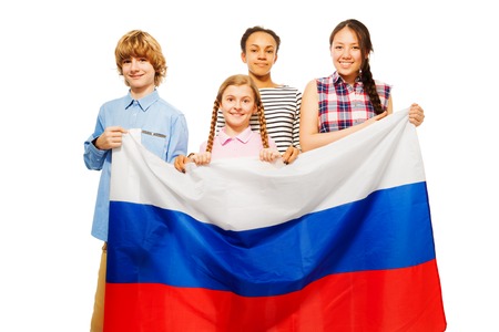 Group of four smiling teenage kids with flag of Russian Federation, isolated on whiteの写真素材
