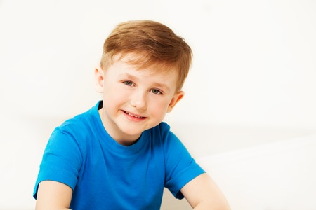 Portrait of happy schoolboy looking at camera