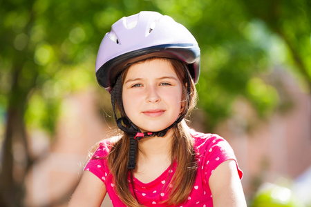 Beautiful preteen girl in safety helmetの写真素材