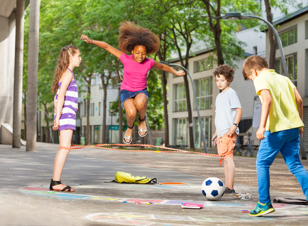 Group of kids play hopscotch on the schoolの写真素材