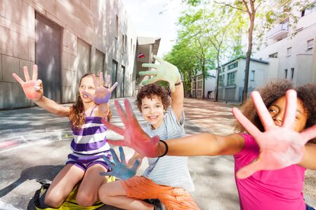 Color in chalk hands of kids group palmsの写真素材