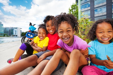 Happy African children having fun together outdoorの写真素材
