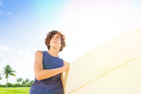 Close portrait of confident little surferの写真素材