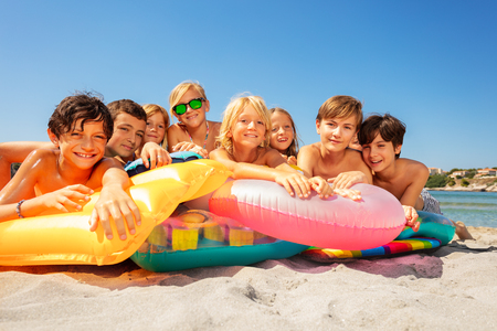 Happy kids spending summer vacation on the beachの写真素材