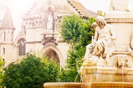 Fountain and church of Sainte Perpetue in Nimesの写真素材