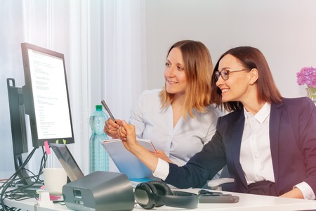 Two business women during meeting in the officeの写真素材