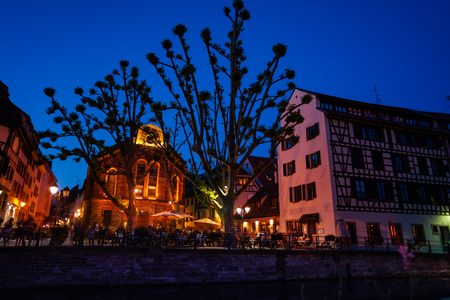 Strasbourg cityscape and Ill river bank at sunsetの写真素材