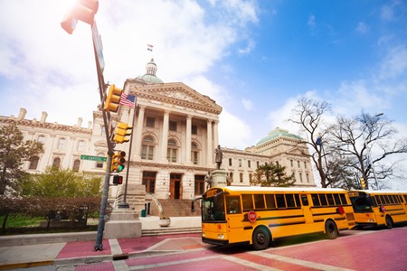 Bus stop in front of Indiana Statehouse buildingの写真素材