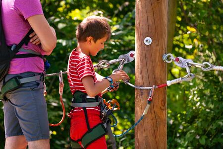 Instructor teach little boy use safety equipmentの写真素材