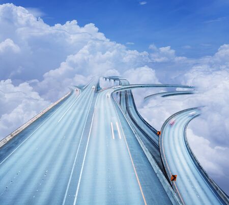 Concept of the highway intersection in clouds skyの写真素材