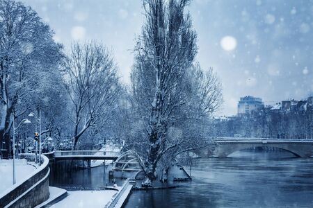 Flooded river embarkment in Paris after snowfallの写真素材