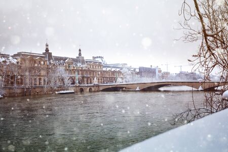 Flooded Seine river in Paris downtown under snowの写真素材