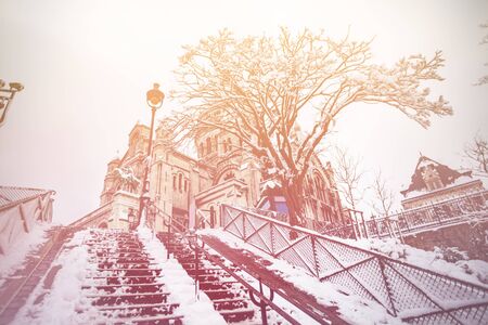 Sacre-Coeur Montmartre Paris staircase under snow view