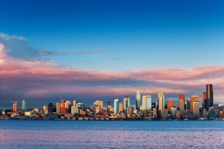 Seattle waterfront downtown buildings wide skyline view at evening sunset on spring day, Washington, USAの写真素材
