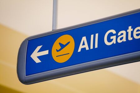 Close-up of all gates direction blue sign in the airport