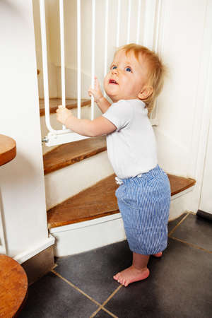 Toddler near stairs security safety guard gateの写真素材