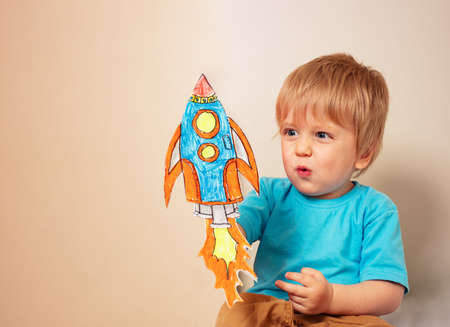 Toddler play astronaut and rocket liftoffの写真素材