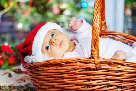 Close-up of a baby girl in basket under NY treeの写真素材