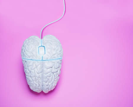 Human brain in form of computer mouse conceptの写真素材