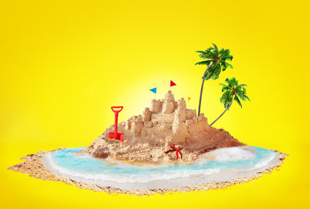Summer concept sand island and sandcastle on beachの写真素材