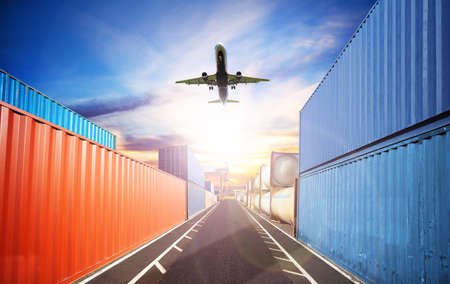 Shipping concept plane fly over containers portの写真素材