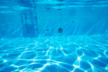 Underwater pool floor photo of rails and ladder stairsの写真素材