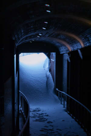 Heavy weather, snow covered entrance for underground passageの写真素材