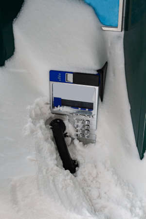 Street phone completely covered with snow in Quebec cityの写真素材