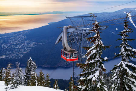 Lift gondola over Vancouver and Capilano lake from Grouse Grindの写真素材