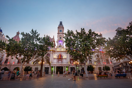 City Hall of Valencia glows at dusk, a top summer tourist spotの写真素材