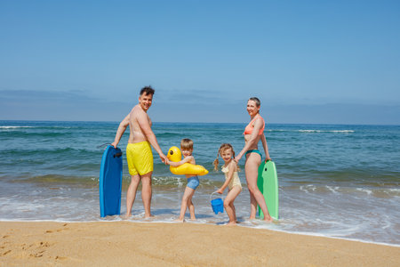 Beachside fun with surfboards and toys, family summer adventureの写真素材