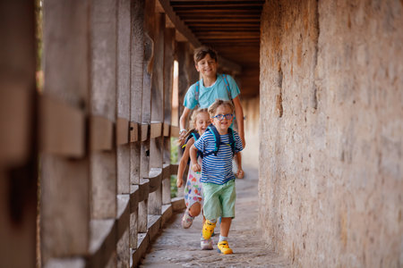 Kids travelers explore old city wall in Rothenburg ob der Tauberの写真素材