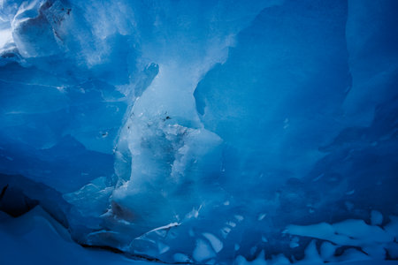 A close-up of sparkling deep blue ice, icy glacier cave partの写真素材