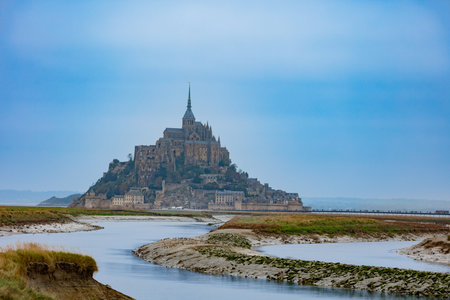 Grand stone fortress silhouetted against the sweeping cloudsの写真素材