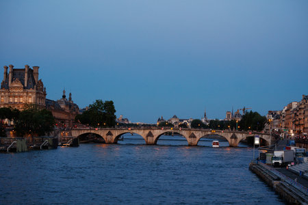Dusk view of Pont Neuf softly lit by lamps over the Seine, Parisの写真素材