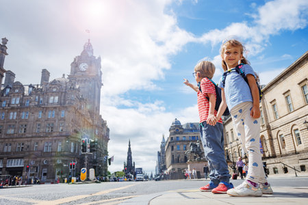 Children travelers sightseeing in Edinburgh downtown, Scotlandの写真素材