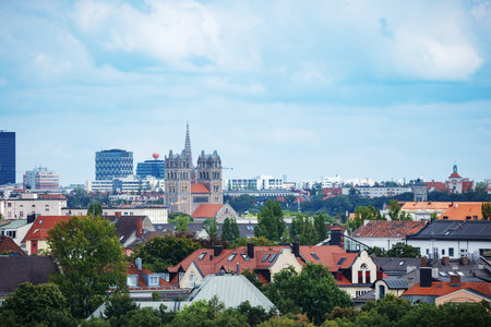 Skyline with historic Cathedral amid modern buildings and housesの写真素材
