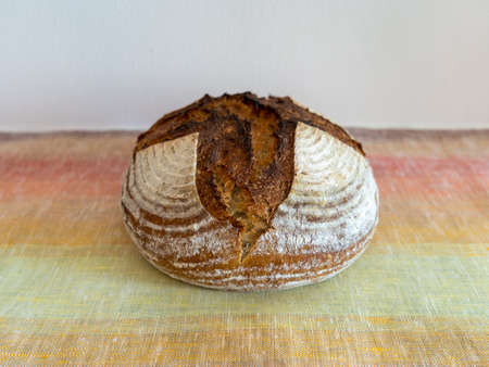 Home-made sourdough bread baked after a long cold- fermentation with organic wheat flour and rye flour.の写真素材
