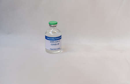 A vial with several doses of a new developed COVID-19 vaccineの写真素材