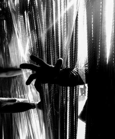 Dark concept with thrust out hands.の写真素材