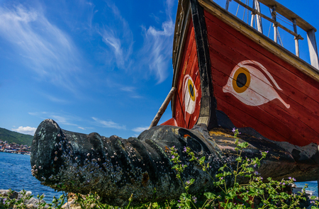 Historical wooden shipwreck reconstruction detail with bamboo on land, Urla, Izmir, Turkey. Ancient Greek culture, Kybele ship. eye pattern.の写真素材
