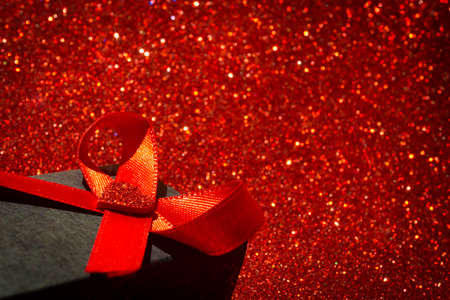 Love concept background for Valentine's Day. Red bokeh lights. Heart shape.