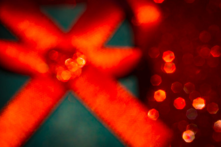 Blurred Valentine's day. Gift box, red hearts on red surface. Space for text. Red light background. Heart shape.の写真素材