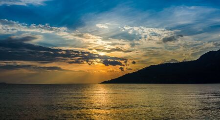 Panoramic sunset landscape with mountains and cloud sky form Marmaris, Kumlubuk, Turkey. Golden Hours.の写真素材