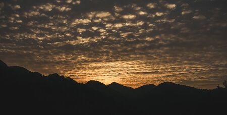 Amazing sunset sky landscape on silhouette mountains. Marmaris, Turkey.