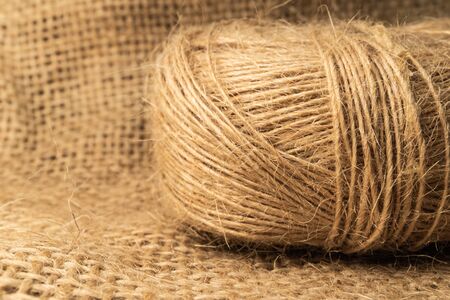 Linen rope roll and natural linen fabric texture.  Soflt light and isolated view.の写真素材