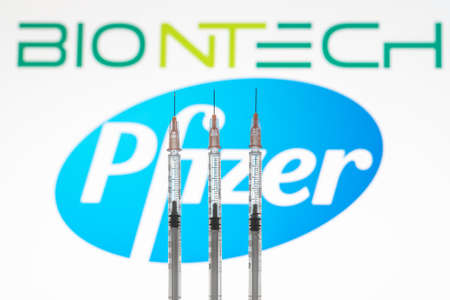 Izmir, Turkey - February 21 2021: Coronavirus vaccine concept and background. Pfizer and biontech vaccine syringes isolated on white background. Covid-19, 2019-nCov pandemic.のeditorial素材