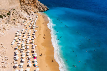 Aerial view of beautiful sandy beach with sunbeds and umbrellasの写真素材