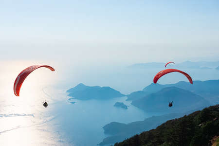 Paragliders flying on Oludeniz beach in Fethiye, Mugla. Travel destination. Summer and holiday...